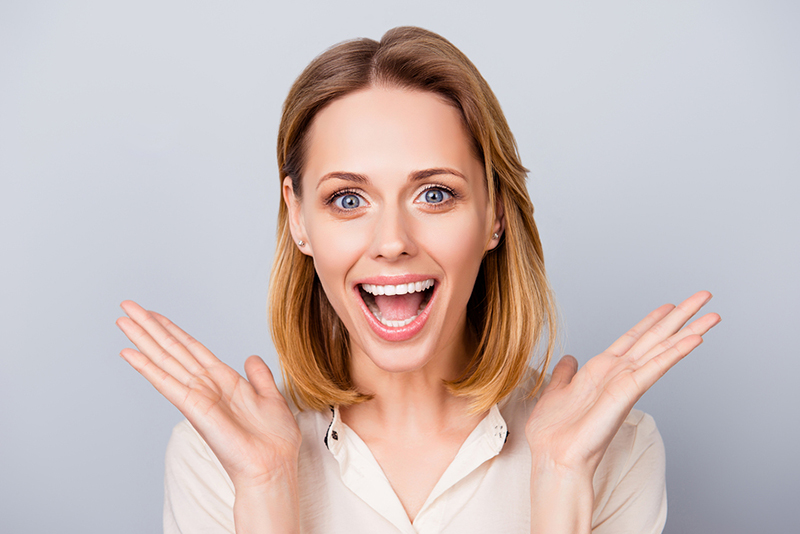 Happy Surprised Young Lady Laughing
